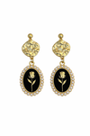 Pair of earrings with black oval centers featuring a rose design, gold accents, and yellow stones on a white background.