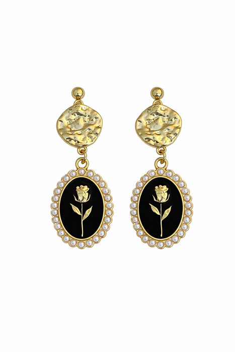 Pair of earrings with black oval centers featuring a rose design, gold accents, and yellow stones on a white background.
