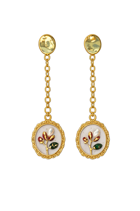 Pair of gold earrings with floral designs on a white background