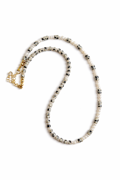 Beaded necklace with a gold clasp on a white background